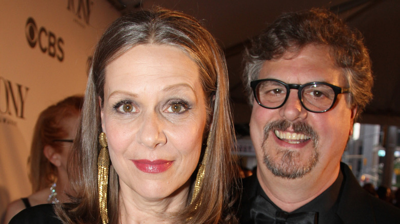 Amy Morton and husband Rob Millburn smiling together in 2013