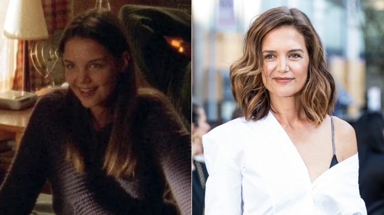 On left, actor Katie Holmes wore her straight brown hair down with a middle part along with neutral makeup while wearing a dark gray cable-knit sweater during an episode of Dawson's Creek. On right, actor Katie Holmes wore her brown hair in beachy waves and a side part with rosy cheeks and a subtle lip along with a crisp white shirt hanging off one shoulder and a strappy black tank underneath at a New York gala screening in April 2026.