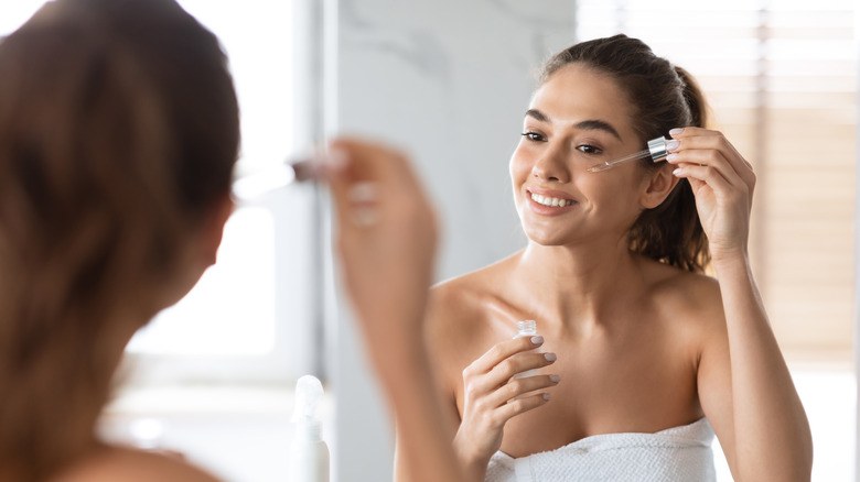 woman applying skincare