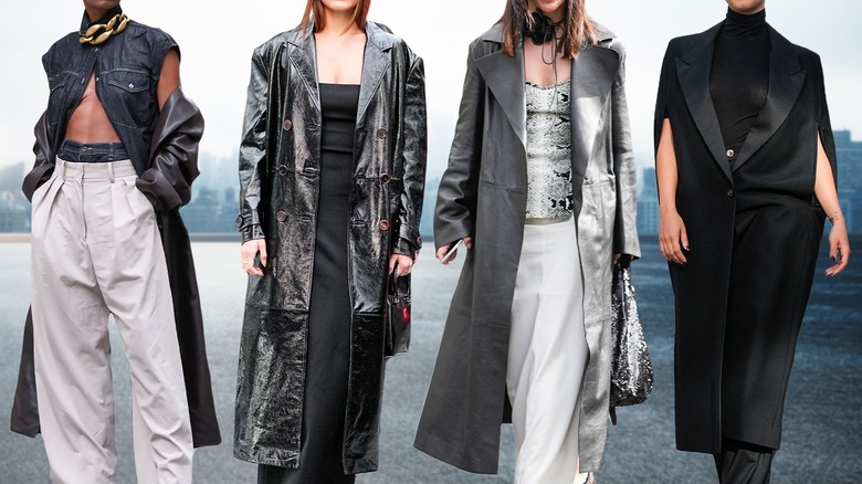 Four women wearing long black coats