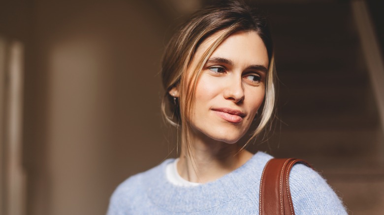 person with low-bun hairstyle