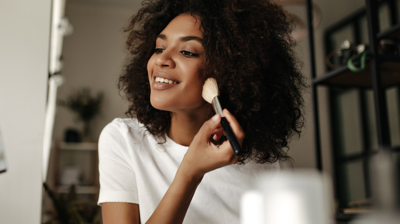 woman doing makeup