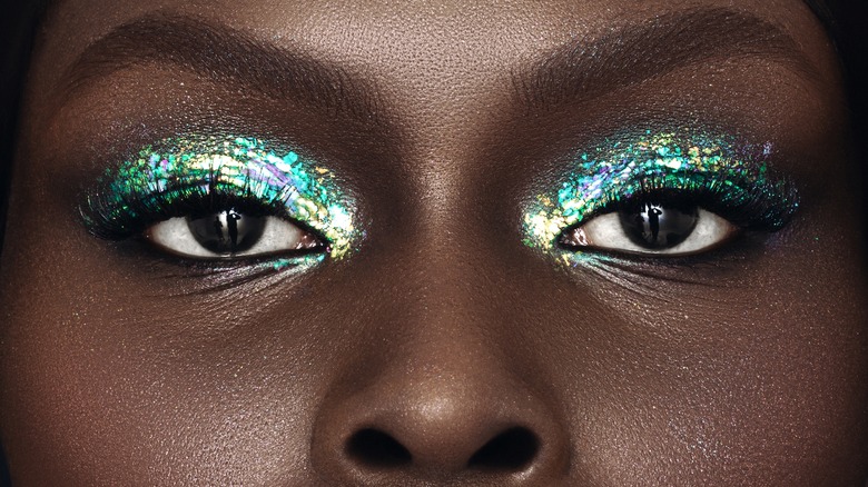 Woman with green glitter eyeshadow