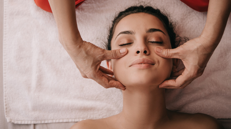 woman getting face massage