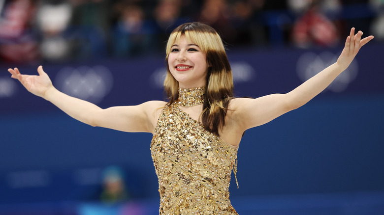 Alysa Liu smiling and extending her arms after winning the Women's Single Skating