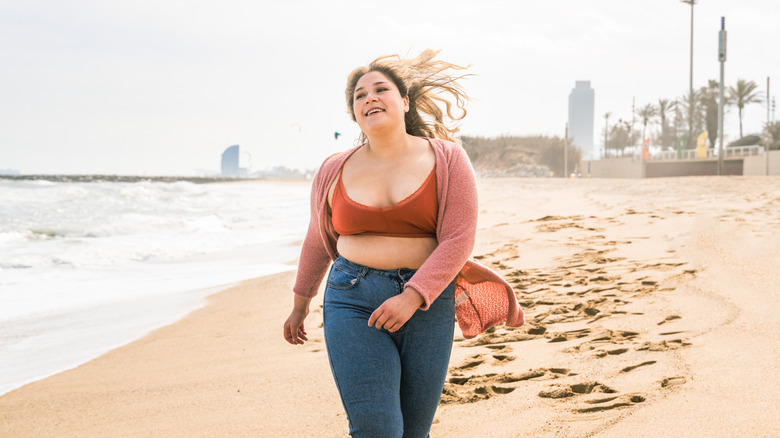 Woman walking on a beach