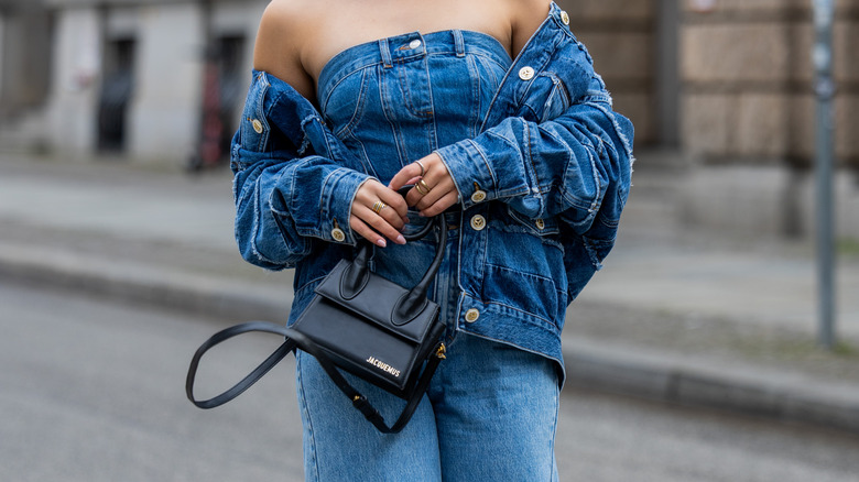 Woman carrying Jacquemus mini bag