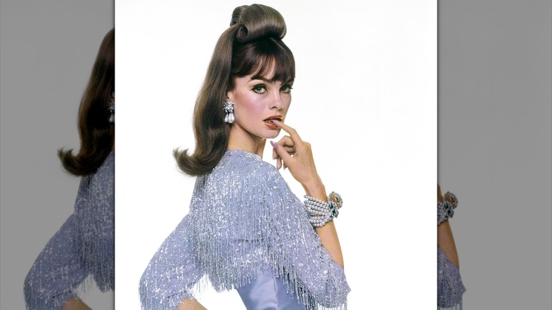 A portrait of Jean Shrimpton in 1963 biting her finger.