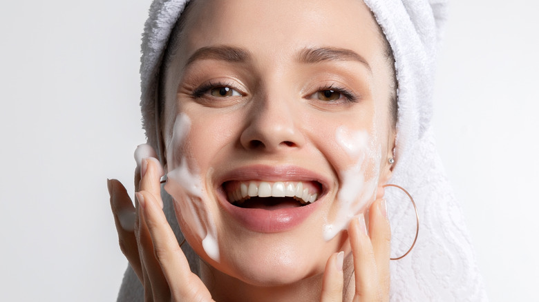 A woman washing her face