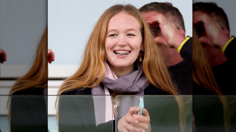 Savannah Phillips watches the Cheltenham horse races