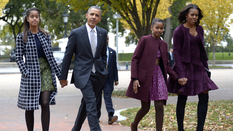 obama family walking down the street