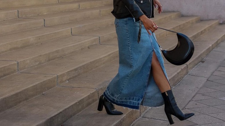 Woman wearing denim maxi skirt