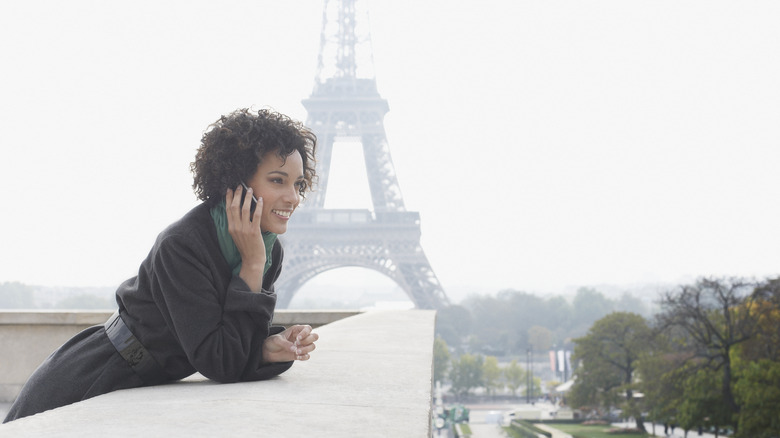 Woman on phone Eiffel Tower