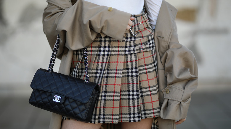 Girl in Burberry plaid skirt.