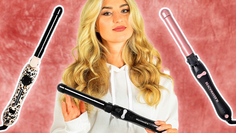 Woman curling hair with curling iron