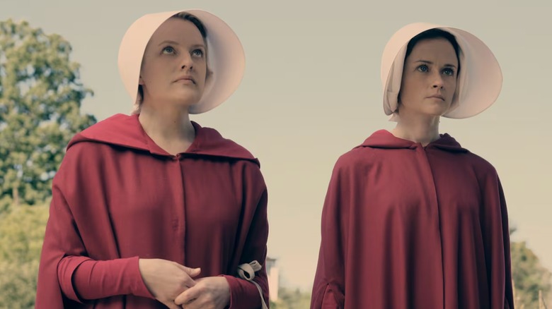 Actors Elisabeth Moss and Alexis Bledel are pictured in a scene from Hulu's The Handmaid's Tale