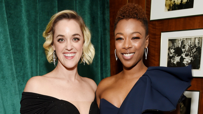Lauren Morelli and Samira Wiley smile while wearing formal gowns at a red carpet event