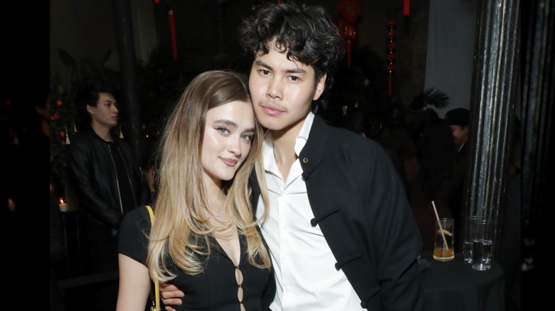 Lizzy Greene and Sean Lew lean into one another while posing for a photo during an evening out