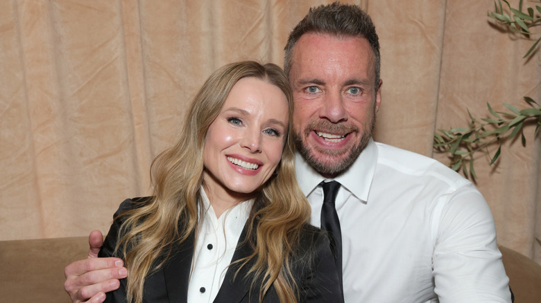 Kristen Bell and husband Dax Shepard cozy up for a photo together at a press event.