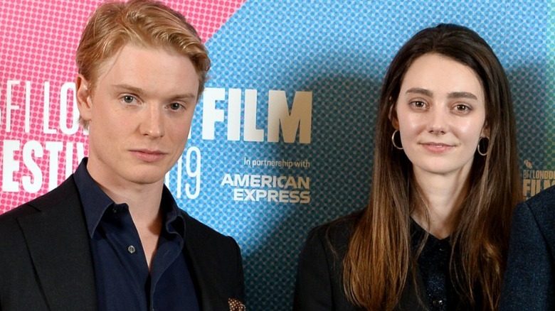 Freddie Fox and Tanya Reynolds pose next to each other at a film festival