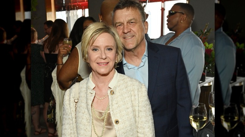 Eve Plumb and husband Ken Pace smile and pose together