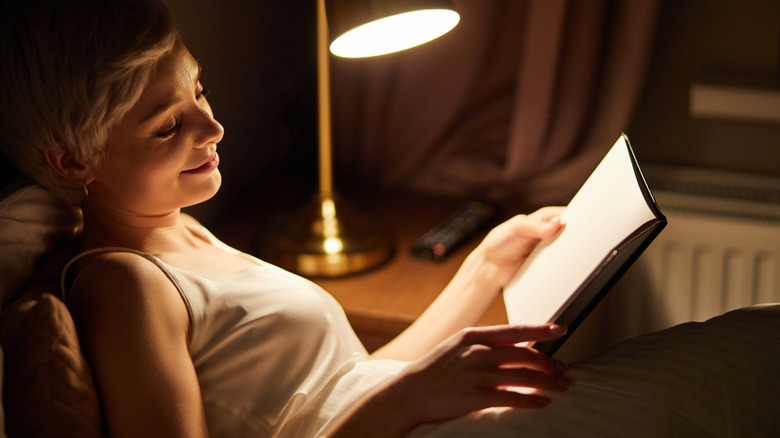 woman reading in bed