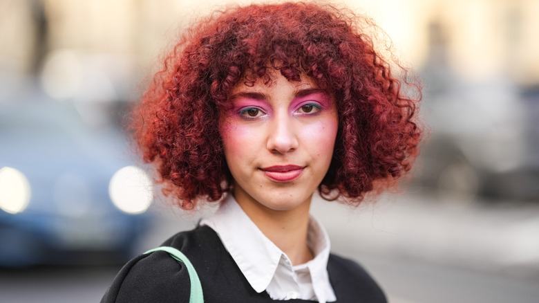 Red curly hair pink eyeshadow