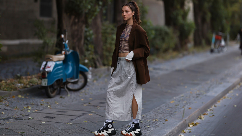 Woman wearing cargo skirt and blazer