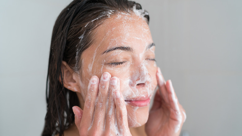 Woman washing face