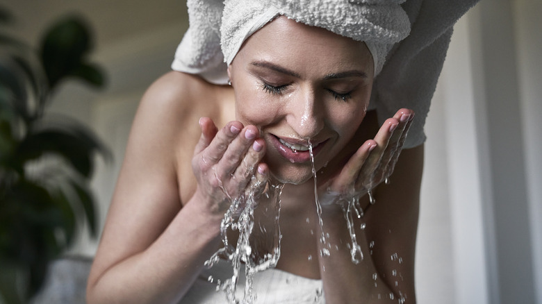 Woman washing face