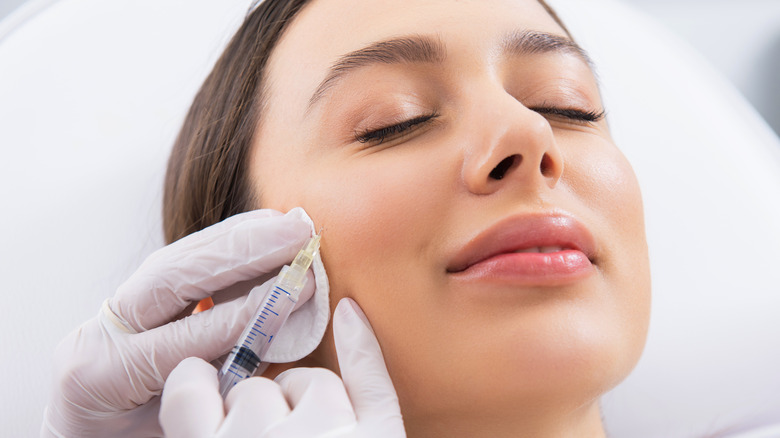 woman getting Botox injection cheeks