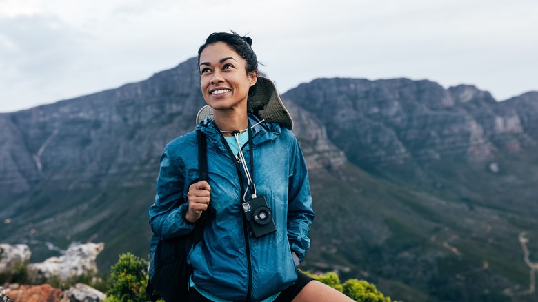 Woman smiling on mountain top