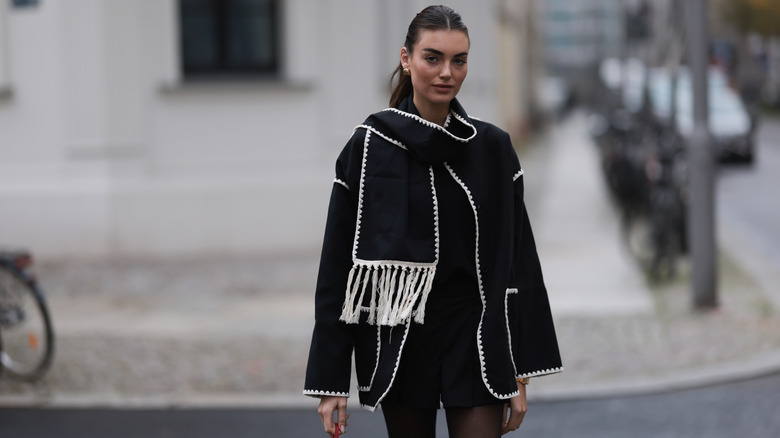 Woman wearing scarf coat