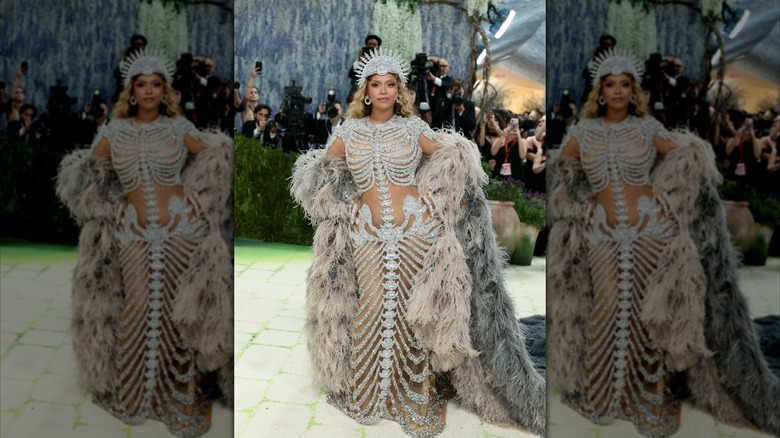 Beyoncé wears a silver Olivier Rousteing dress and headpiece at the 2026 Met Gala