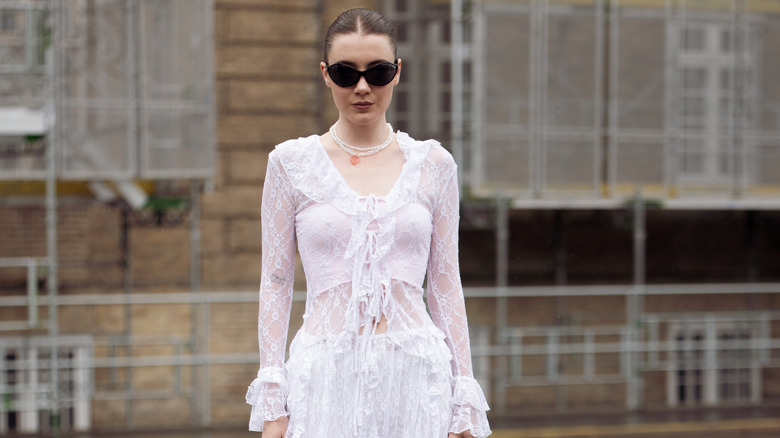 woman in sheer white outfit 