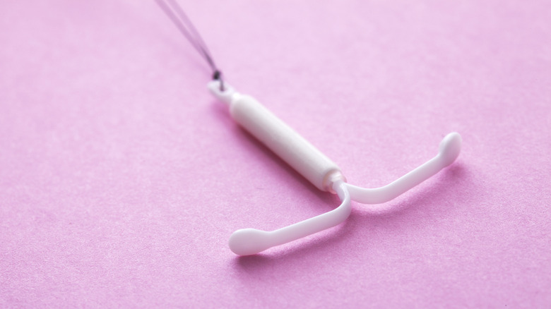 IUD on a pink table