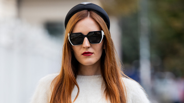 Woman wearing black Prada headband