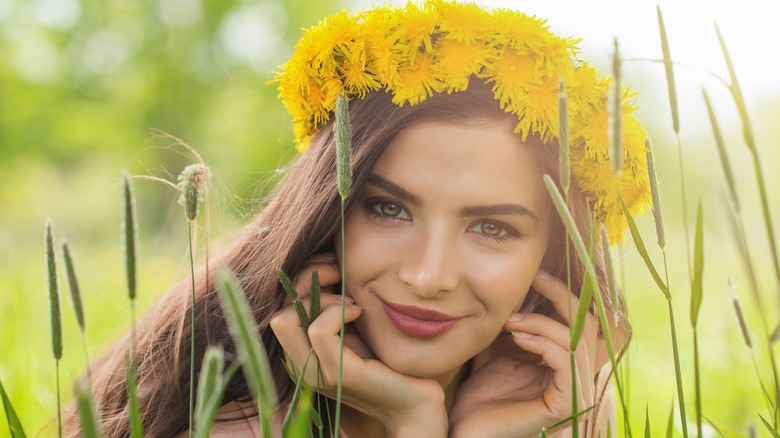 Girl in nature with dandelion headband