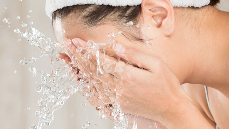 woman washing face