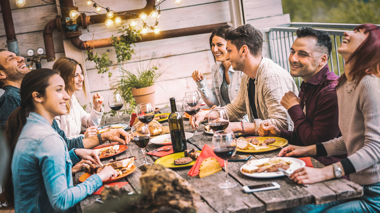 Friends eating dinner together