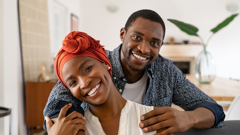 black couple on sofa