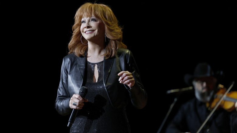 Reba smiling on stage