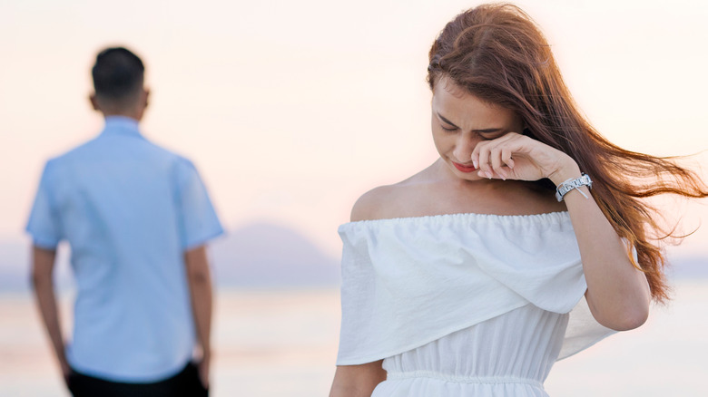 Crying woman leaving boyfriend