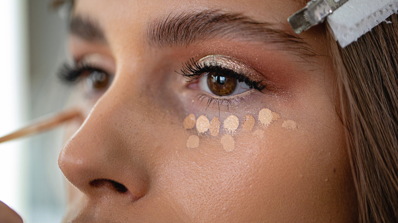 woman with unblended concealer dots