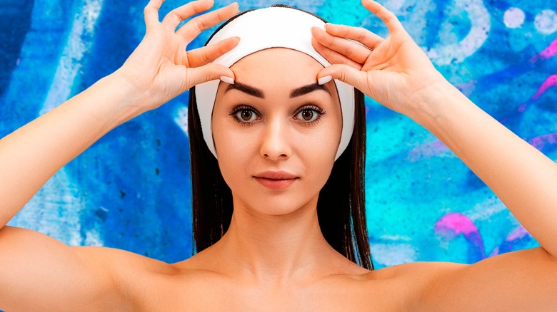 woman wearing headband to lift hair