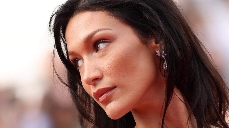 Bella Hadid glancing to the side on red carpet 