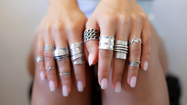 hands with stacked rings