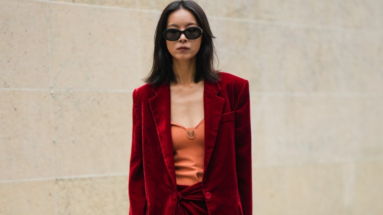 woman with red blazer and top