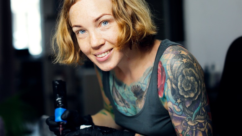 Woman with arms and chest tattoos