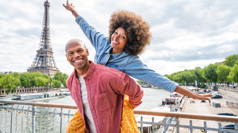 Couple poses on bridge